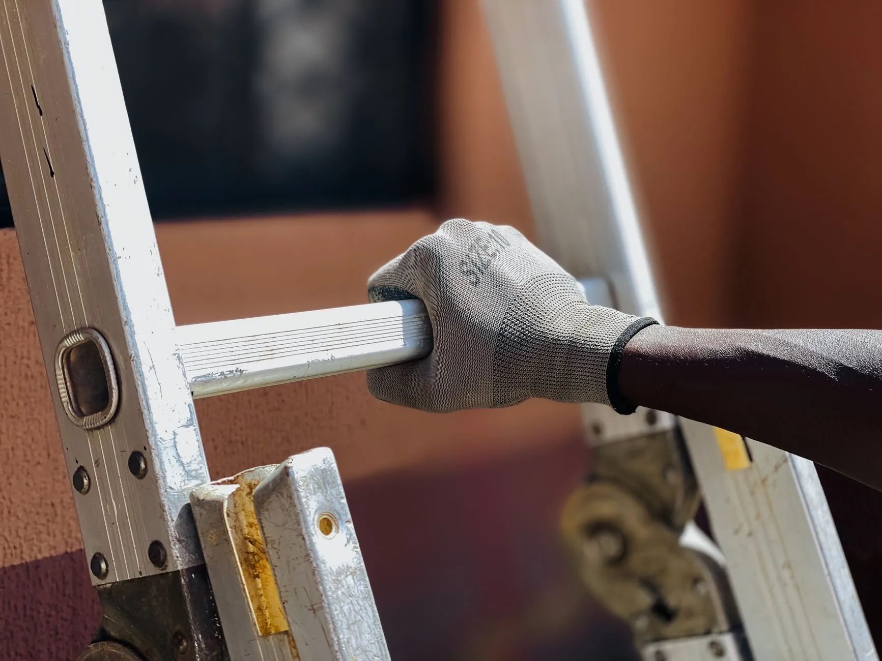 A person using a ladder for a home repair project