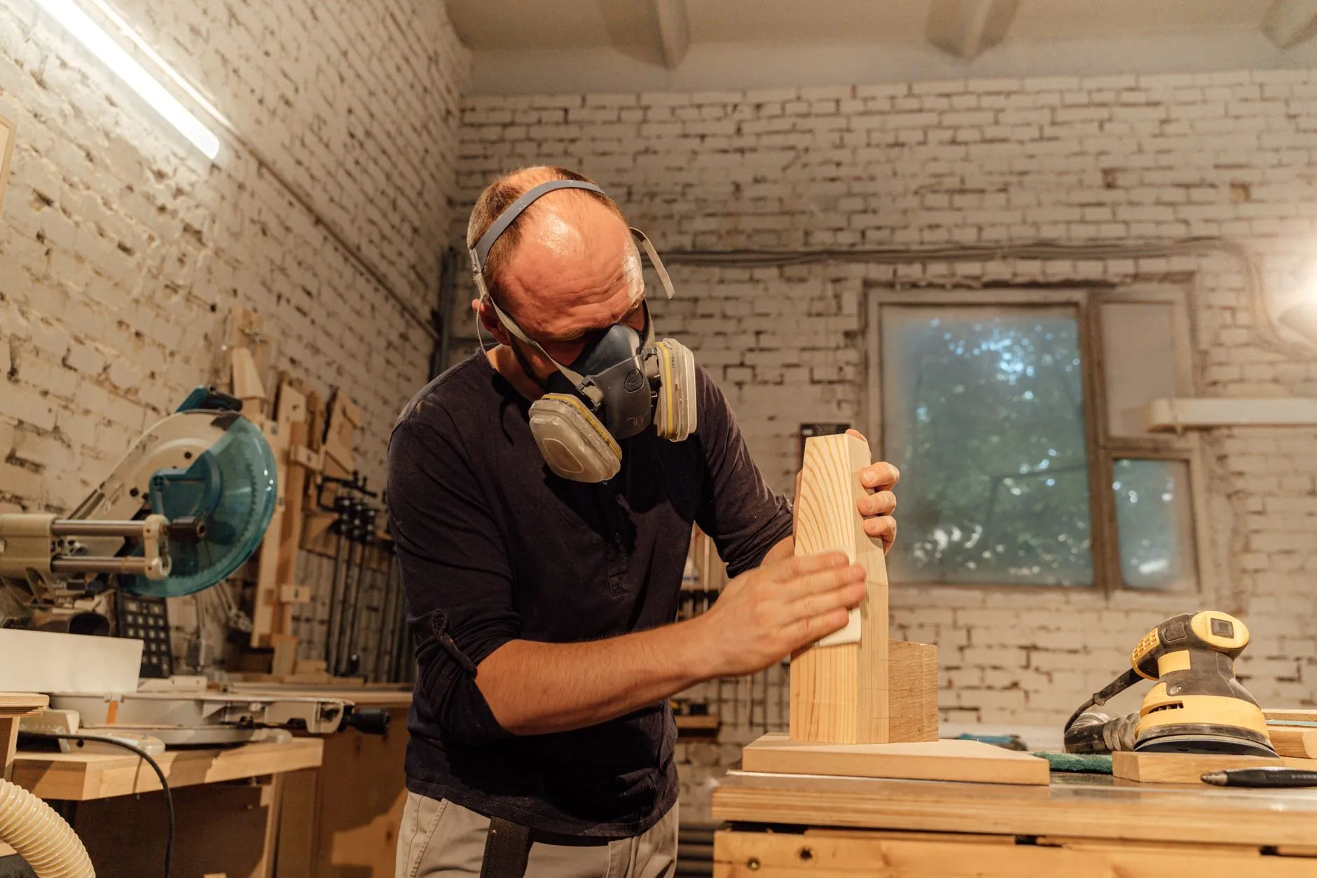A person building a wood workbench frame